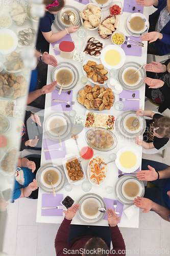 Image of iftar dinner muslim family together during a ramadan feast at ho