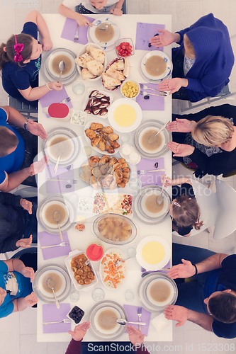 Image of iftar dinner muslim family together during a ramadan feast at ho