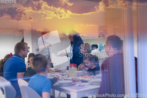 Image of Eid Mubarak  Islamic family praying before halal Iftar dinner