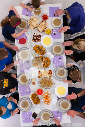 Image of iftar dinner muslim family together during a ramadan feast at ho