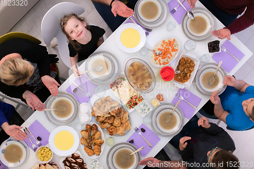 Image of iftar dinner muslim family together during a ramadan feast at ho