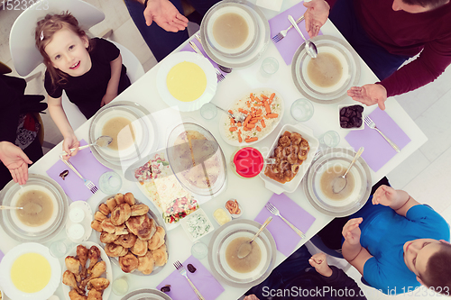 Image of iftar dinner muslim family together during a ramadan feast at ho