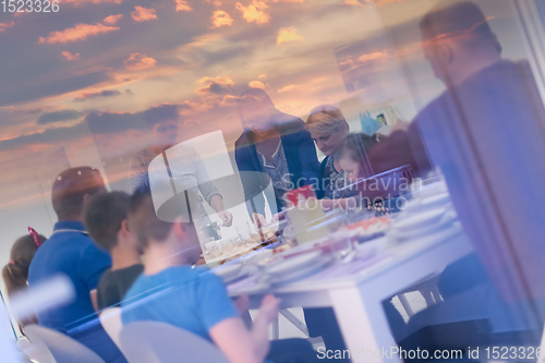 Image of Eid Mubarak  Islamic family praying before halal Iftar dinner