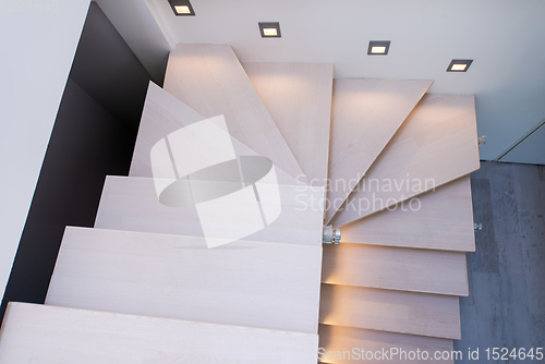 Image of stylish interior with wooden stairs