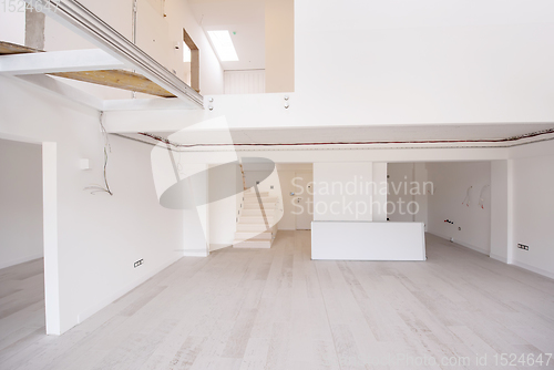 Image of Interior of empty stylish modern open space two level apartment