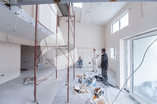 Image of portrait of Workers and builders with dirty uniform in apartment