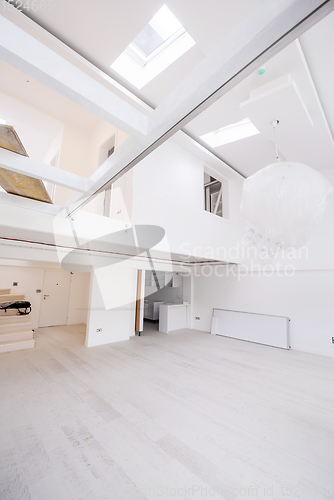 Image of Interior of empty stylish modern open space two level apartment