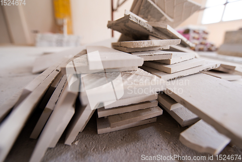 Image of pile of ceramic wood effect tiles