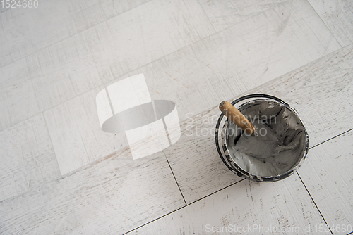 Image of Ceramic wood effect tiles and tools for tiler on the floor