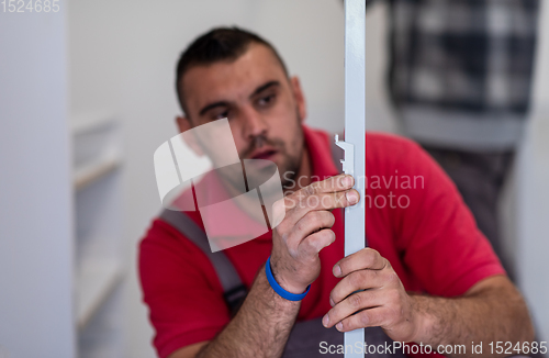 Image of worker installing a new kitchen