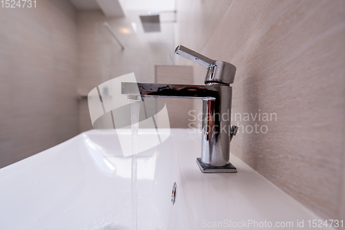 Image of Open Water Faucet