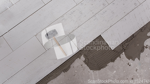 Image of Ceramic wood effect tiles and tools for tiler on the floor