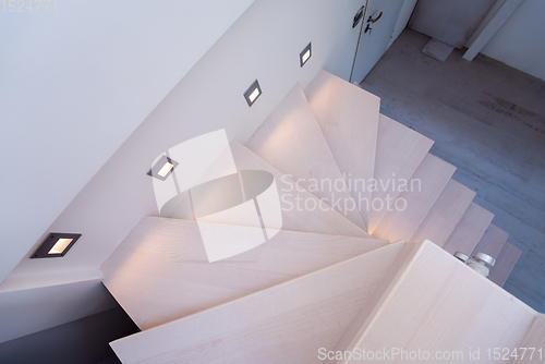 Image of stylish interior with wooden stairs