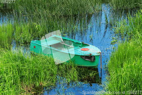 Image of Metal rowboat on the lake 