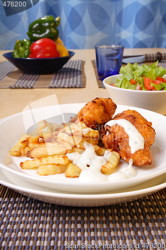 Image of French fries and chicken