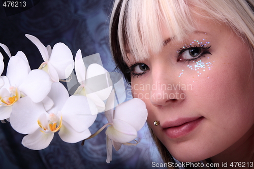 Image of Woman and orchid