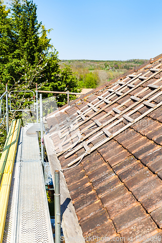 Image of renovation of a brick tiled roof