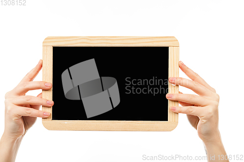 Image of woman\'s hands holding a blackboard publicity