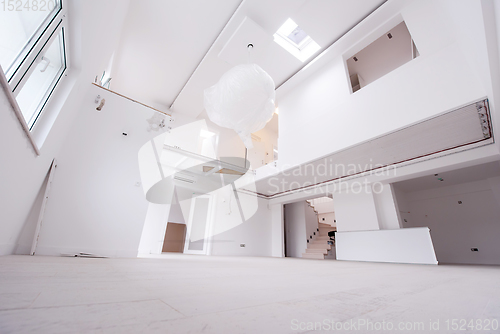 Image of Interior of empty stylish modern open space two level apartment