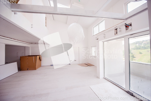 Image of Interior of empty stylish modern open space two level apartment