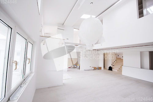 Image of Interior of empty stylish modern open space two level apartment