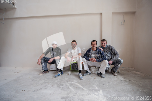Image of portrait of Workers and builders with dirty uniform in apartment