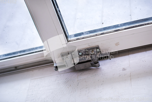 Image of carpenters installing a balcony door