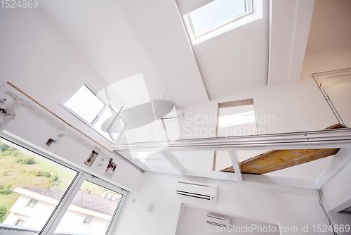 Image of Interior of empty stylish modern open space two level apartment