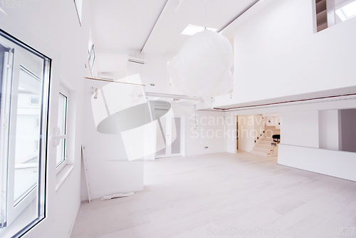 Image of Interior of empty stylish modern open space two level apartment