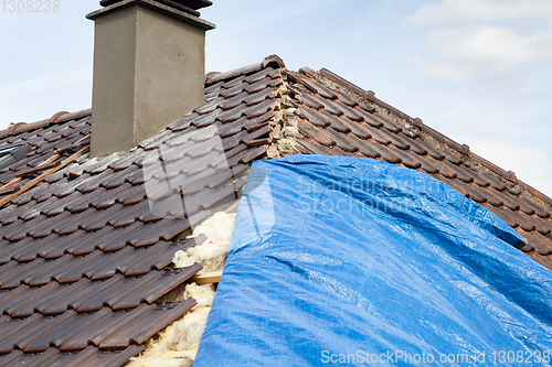 Image of renovation of a brick tiled roof