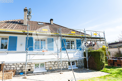 Image of renovation of a brick tiled roof