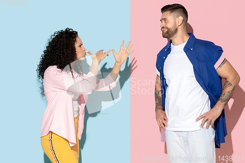 Image of Young emotional man and woman on pink and blue background