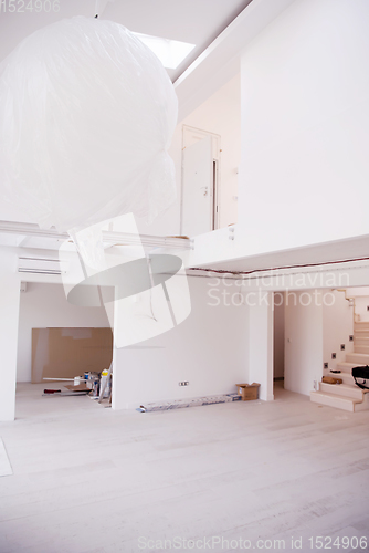 Image of Interior of empty stylish modern open space two level apartment