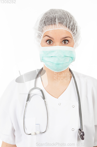 Image of young woman doctor with stethoscope and mask