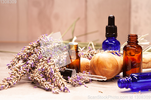 Image of lavender mortar and pestle and bottles of essential oils for aro