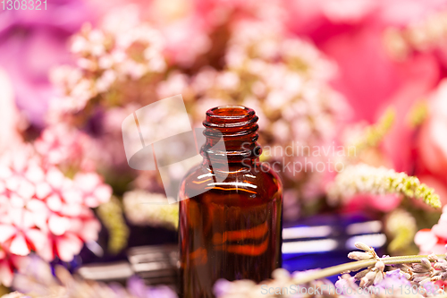 Image of flowers and bottles of essential oils for aromatherapy