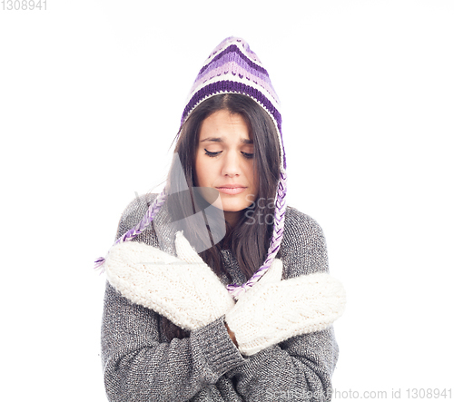 Image of pretty brunette woman with a woolen Peruvian hat a sweater and g