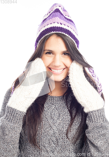 Image of pretty brunette woman with a woolen Peruvian hat a sweater and g