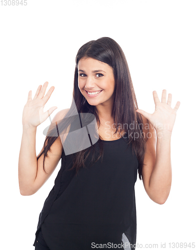 Image of beautiful happy young woman in black dress and hands in the air