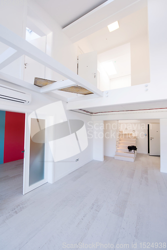 Image of Interior of empty stylish modern open space two level apartment