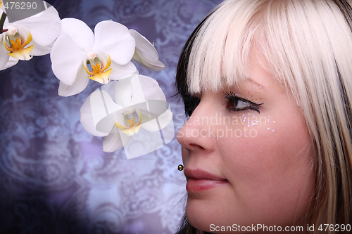 Image of Woman and orchid