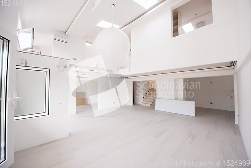 Image of Interior of empty stylish modern open space two level apartment