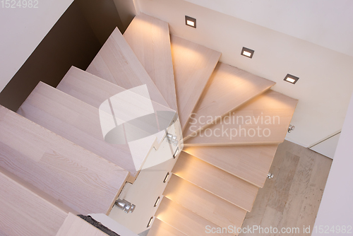 Image of stylish interior with wooden stairs