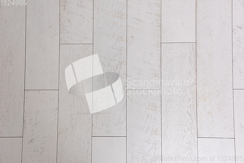 Image of Ceramic wood effect tiles and tools for tiler on the floor