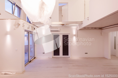 Image of Interior of empty stylish modern open space two level apartment