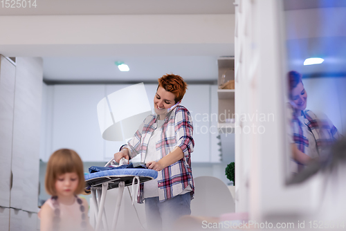 Image of mother and daughter spending time together at home