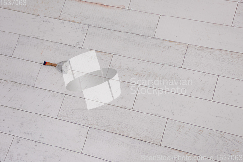 Image of Ceramic wood effect tiles and tools for tiler on the floor