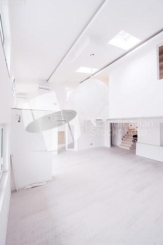 Image of Interior of empty stylish modern open space two level apartment