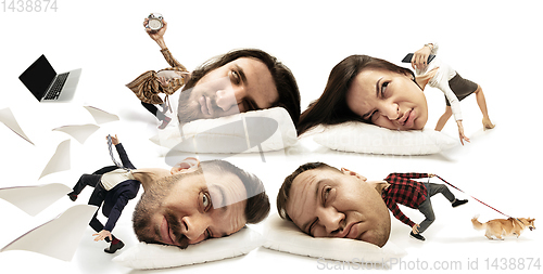Image of Big heads on small bodies lying on the pillow
