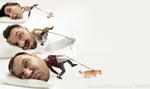 Image of Big heads on small bodies lying on the pillow